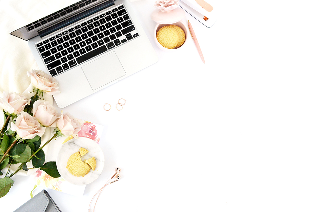 Clear Email Inbox Laptop on desk with flowers roses and biscuits